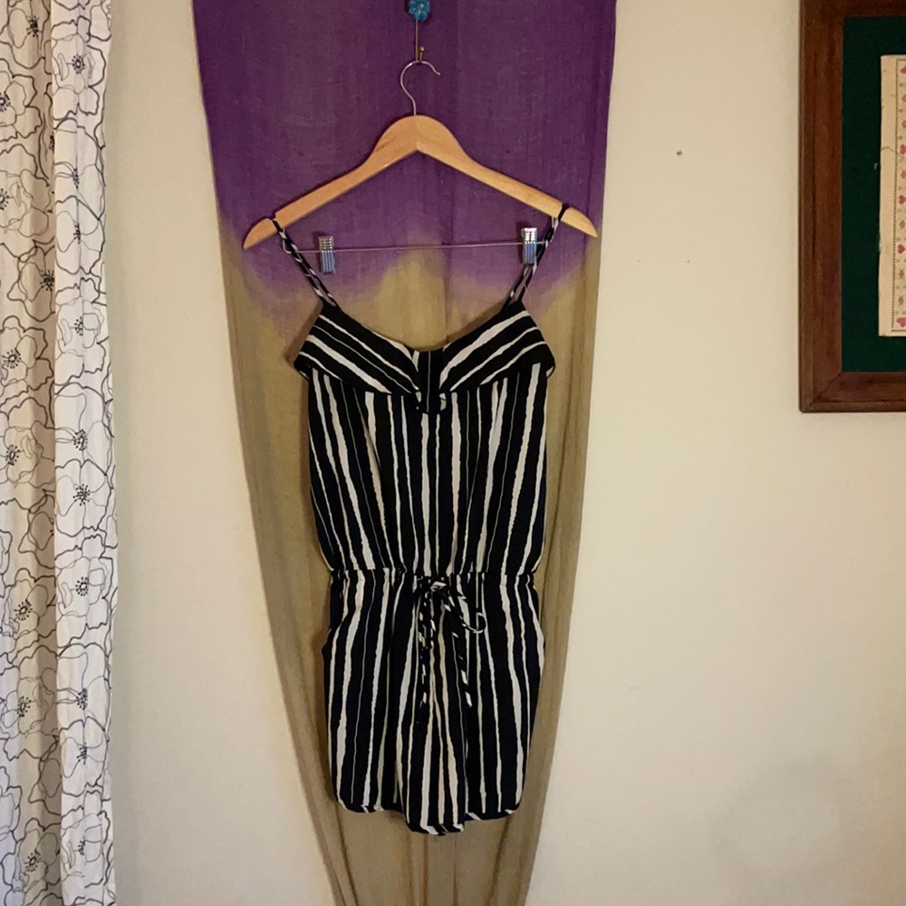 It has pockets!  Romper!
